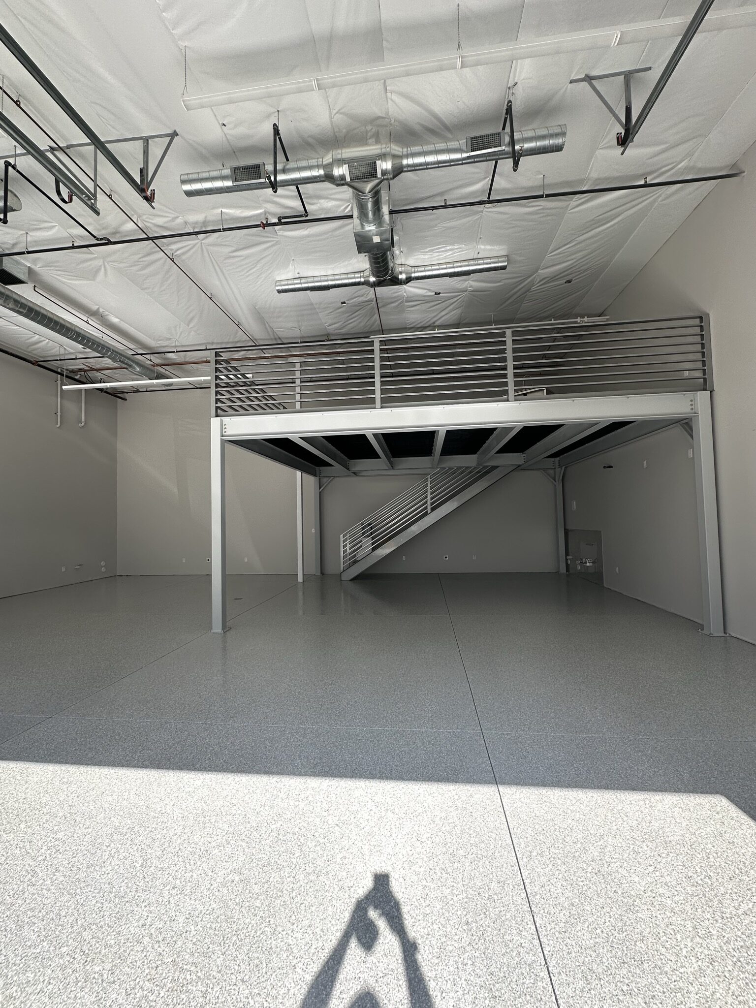 Gray Blue Flake commercial floor coating with mezzanine in Fountain Hills AZ by RX Garage