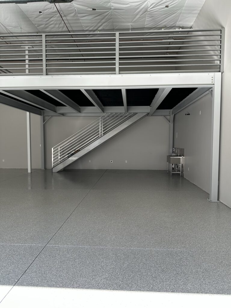 Gray Blue Flake commercial floor coating with staircase in Fountain Hills AZ by RX Garage